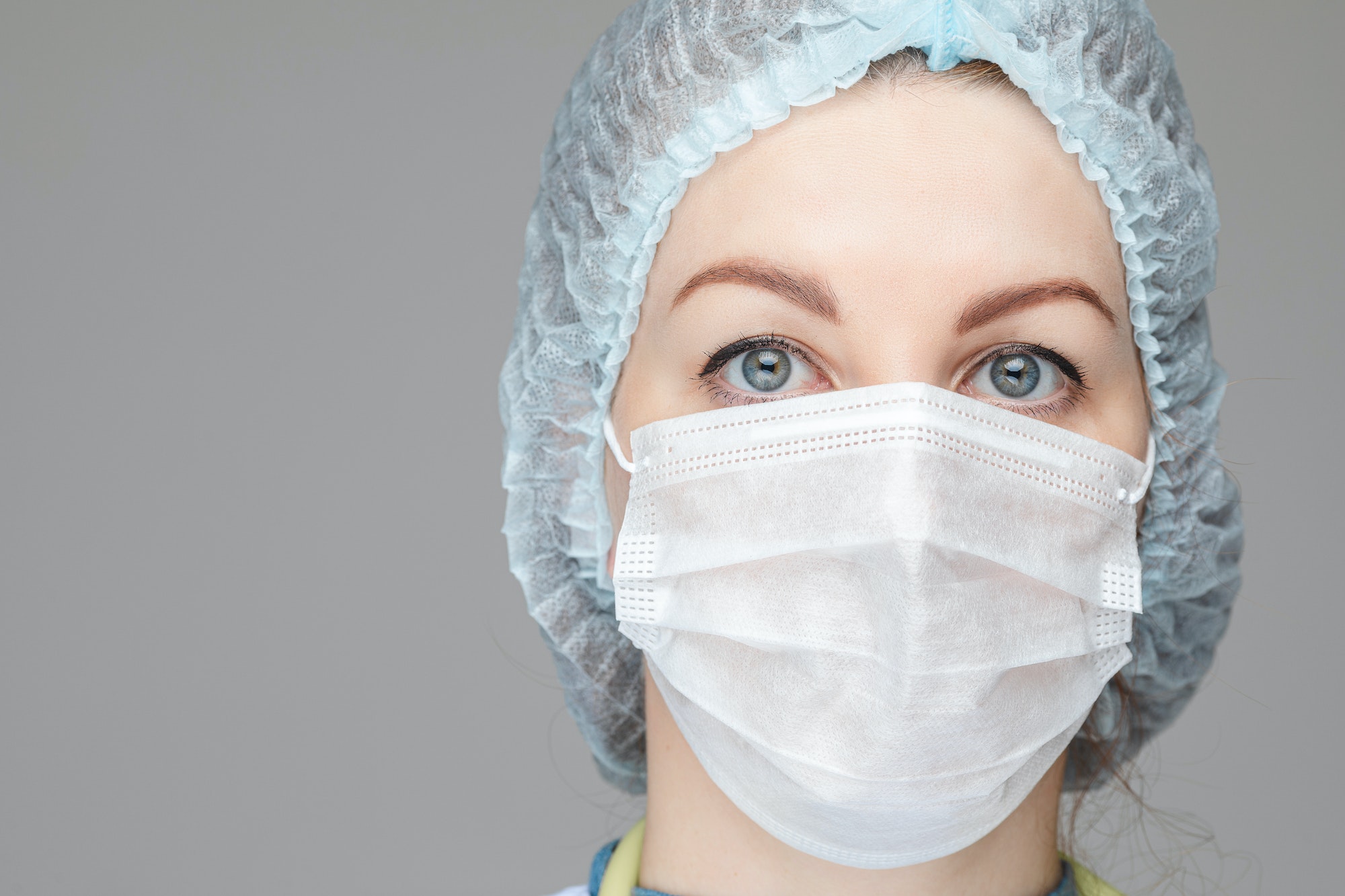 Doctor in PPE looking at camera. Real heroes of our time